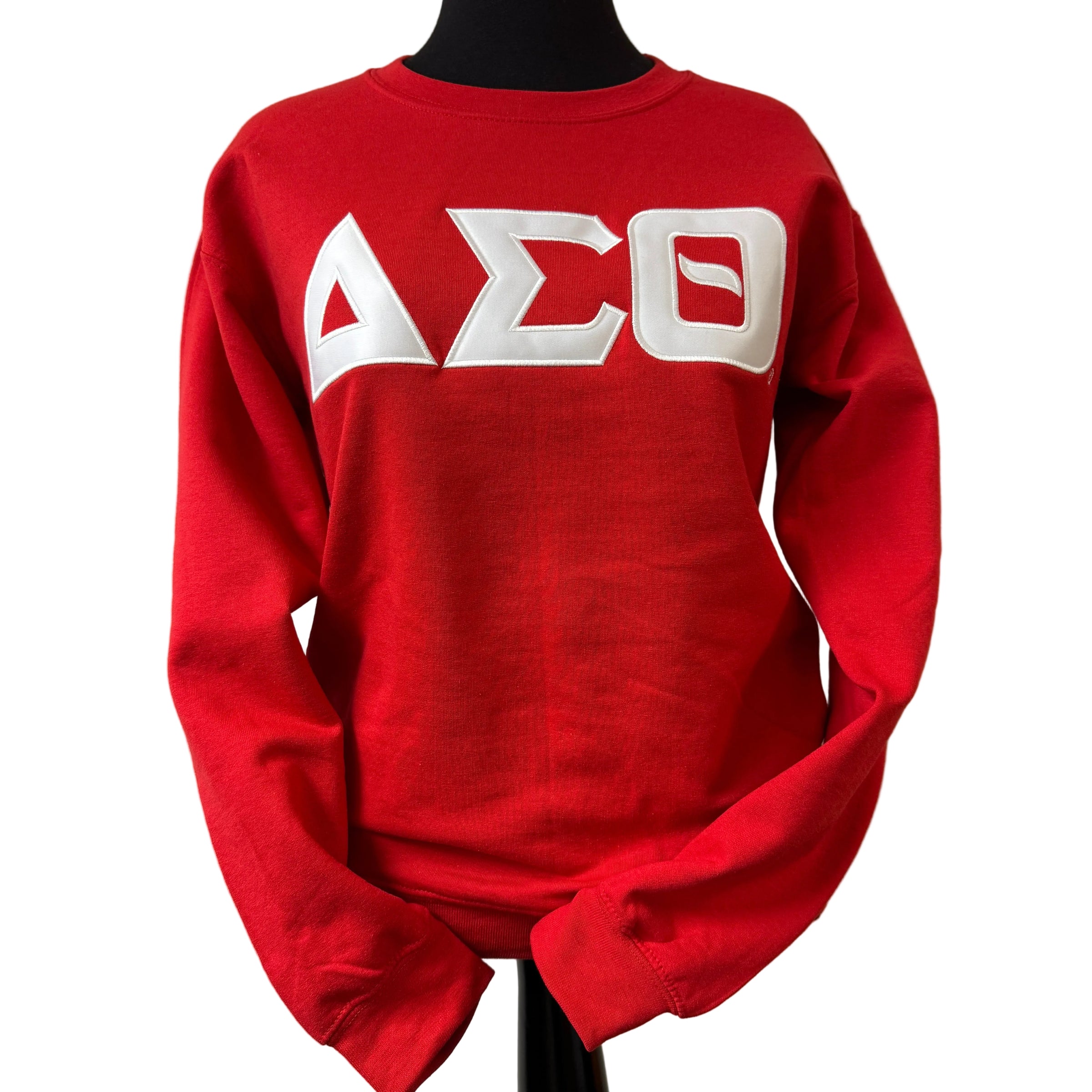 Red sweatshirt with white letters on a beige background