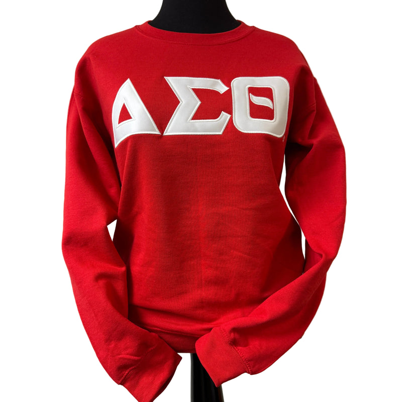 Red sweatshirt with white letters on a beige background