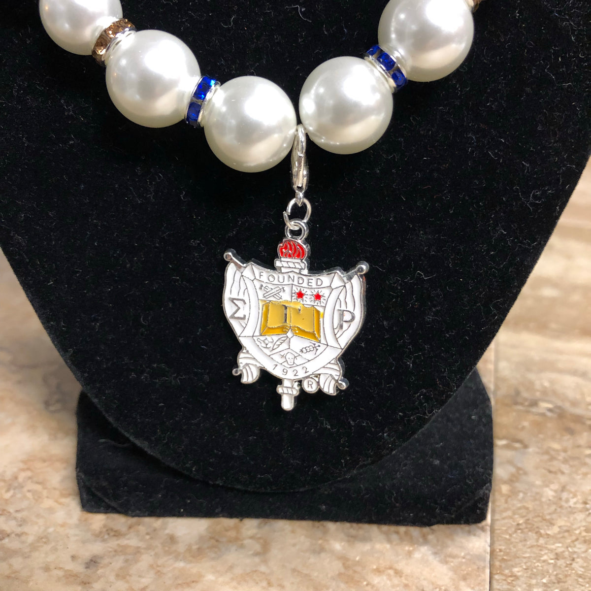SGRho Pearls with Shield Charm Necklace